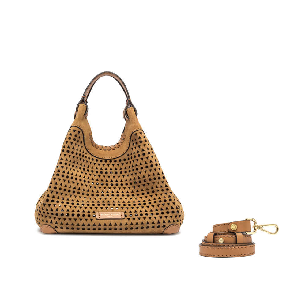 Stylish DUA handbag in perforated suede with detachable leather strap, showcasing contemporary design and practical features.