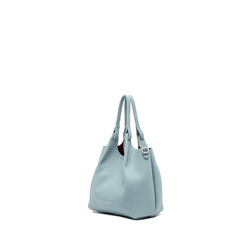 DUA handbag in light blue leather with two handles and magnet closure, perfect for any outfit.