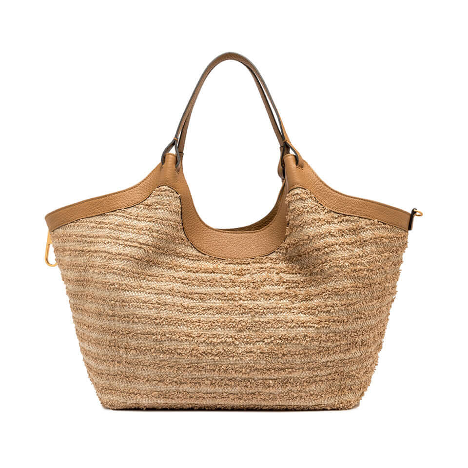 Handcrafted straw bag by DUA with stitched leather accents and double handles, perfect for any outfit.