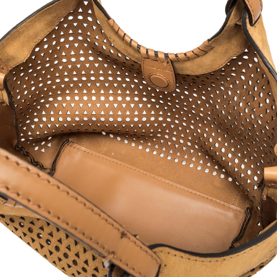Interior view of the DUA bag showcasing stylish perforated design and zippered pouch for added practicality.