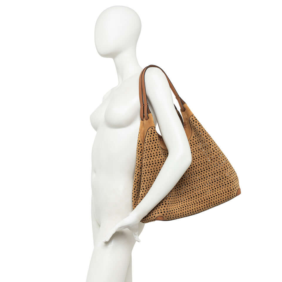 Contemporary DUA shoulder bag in perforated suede, featuring zip pouch and adjustable moschettoni.