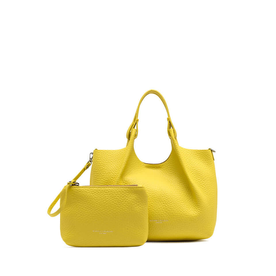 Yellow leather handbag with matching pouch, perfect for enhancing any outfit.