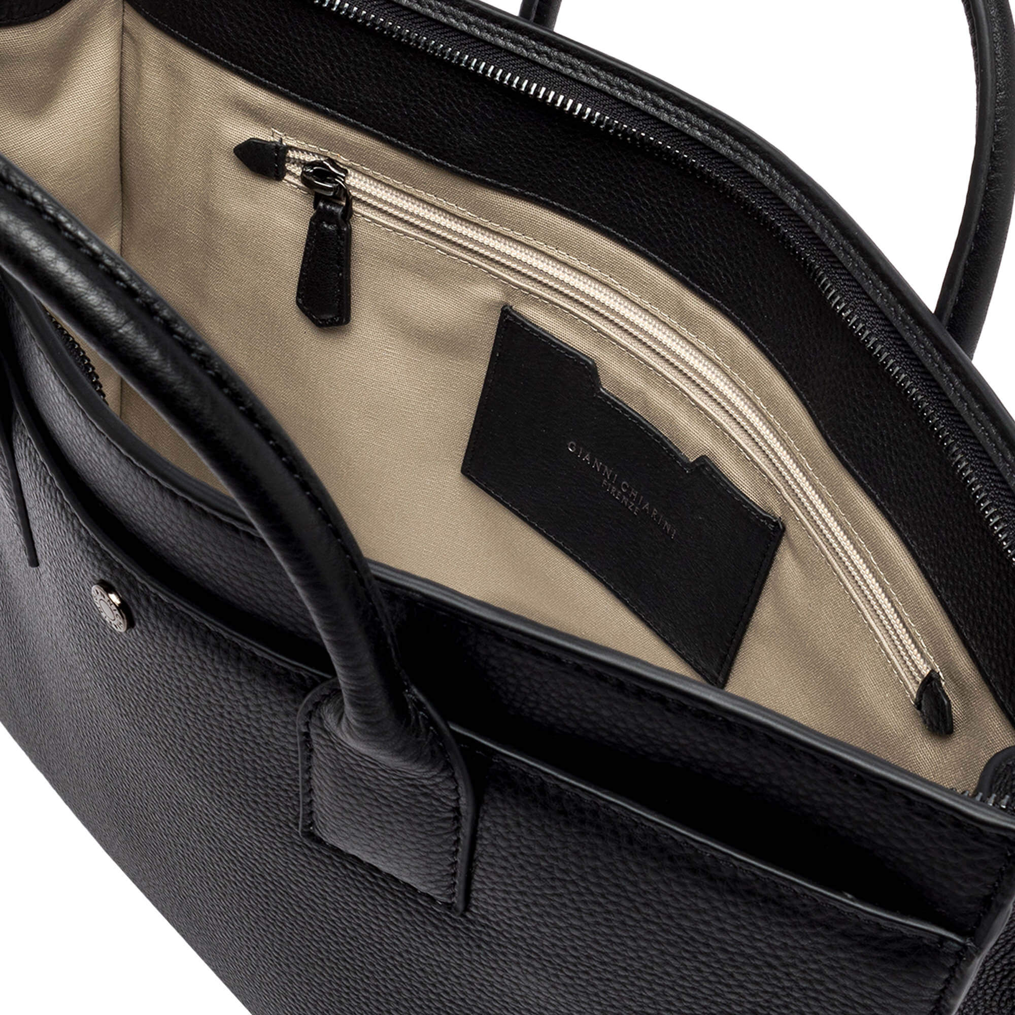 Inside view of FLORENCE leather bag showing zip compartment and logo card holder, ideal for contemporary style.
