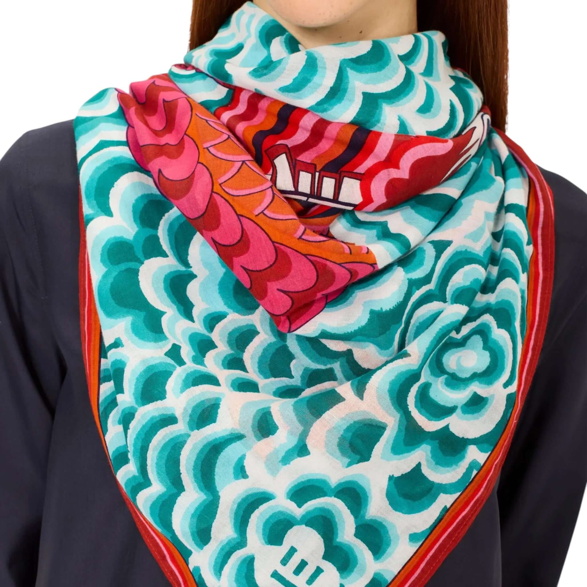 Colorful Foulard Quadrato Dragon, featuring bold patterns in teal and red, perfect for stylish layering and hand-washing at 30°C.