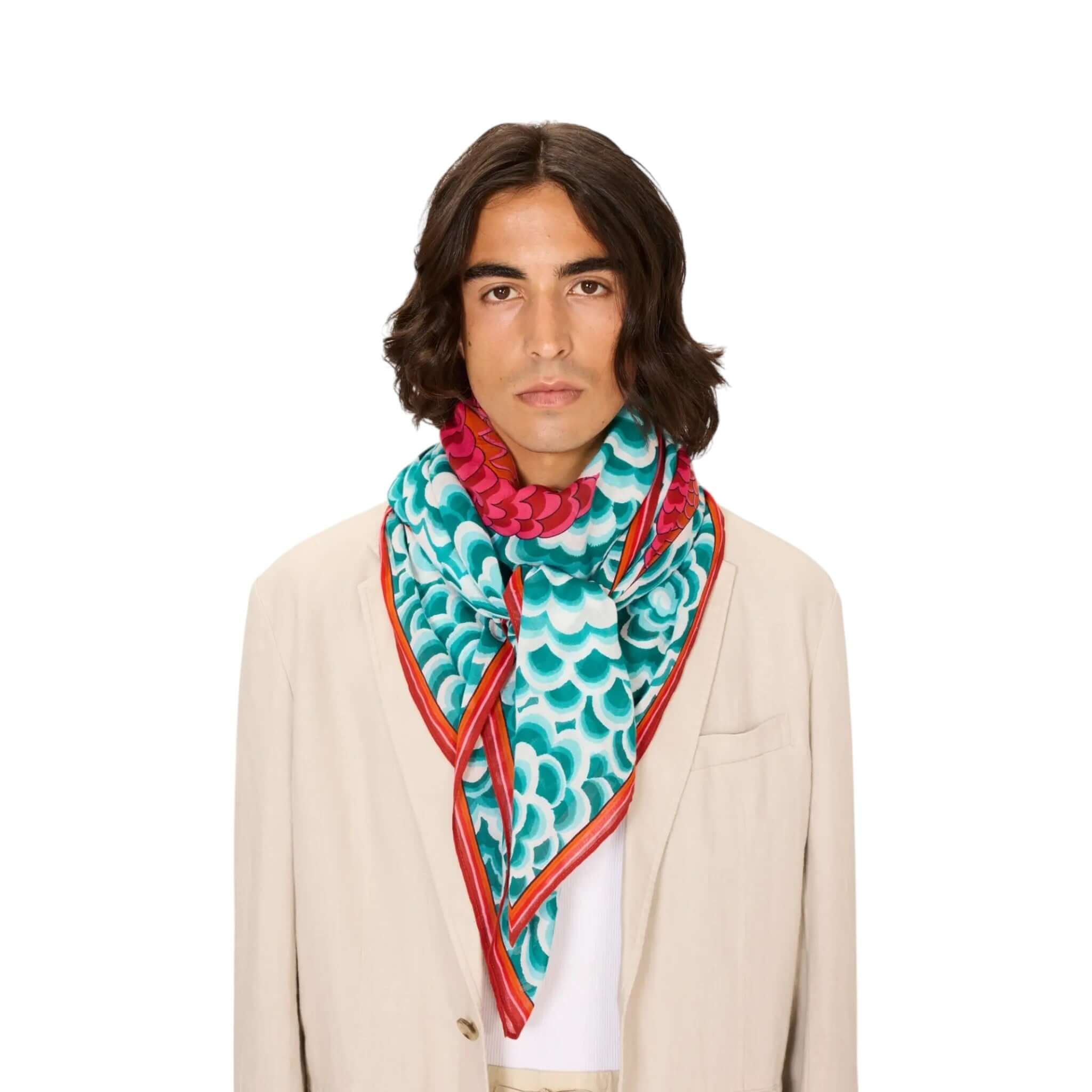 Model wearing the Foulard Quadrato Dragon scarf featuring vibrant colors and detailed prints.