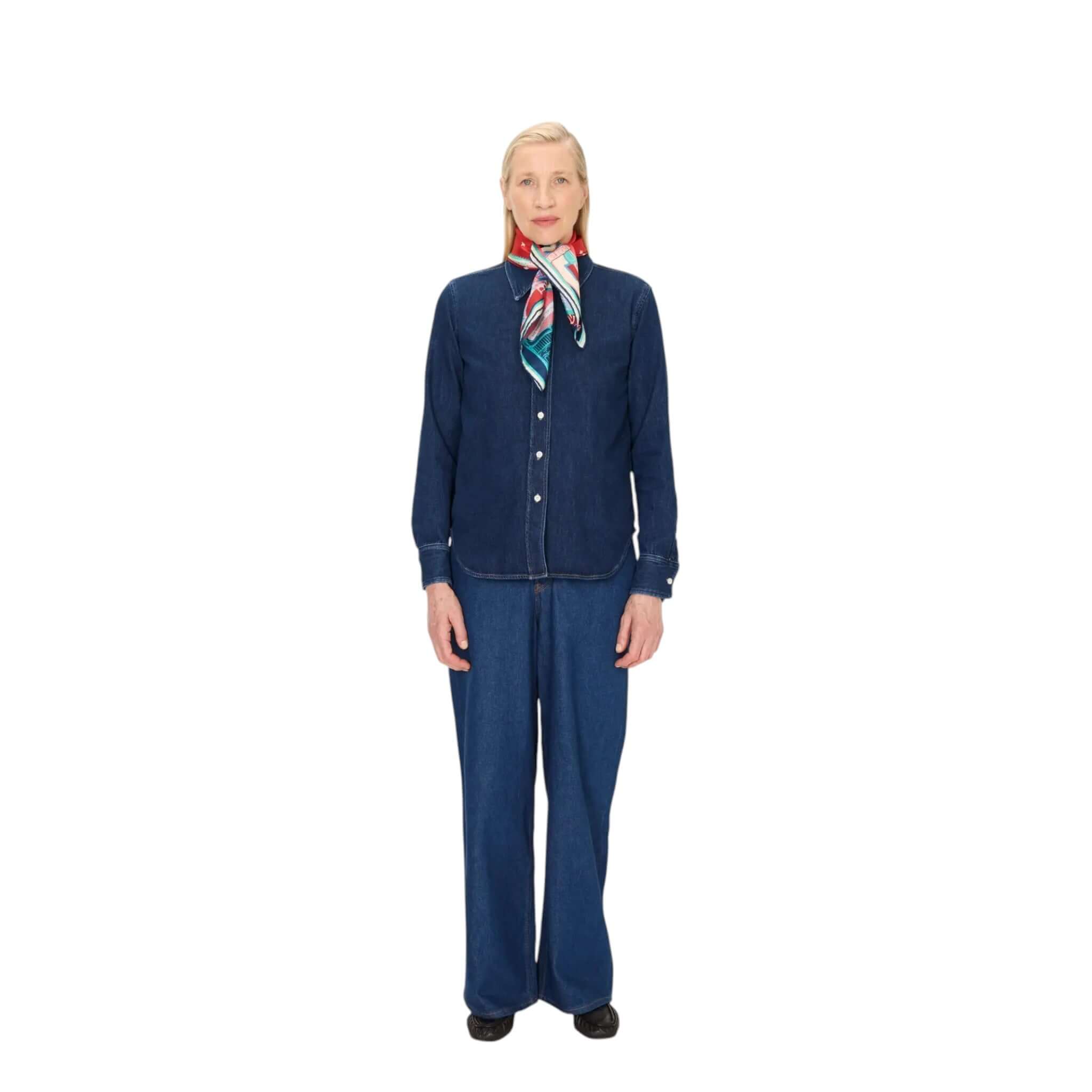 Model showcasing a denim outfit complemented by the J'aime Paris silk scarf, perfect for stylish layering.