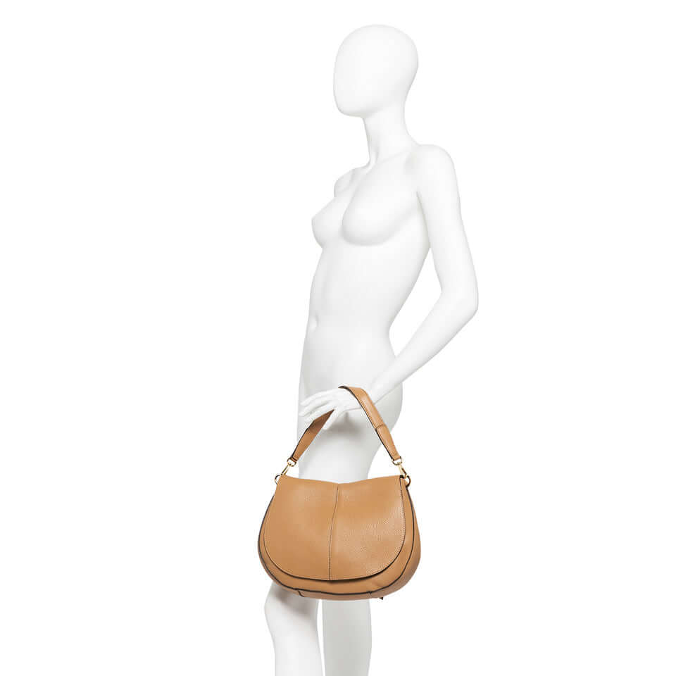 Helena Round handbag by Gianni Chiarini Firenze, structured design in hammered leather, displayed on a mannequin.
