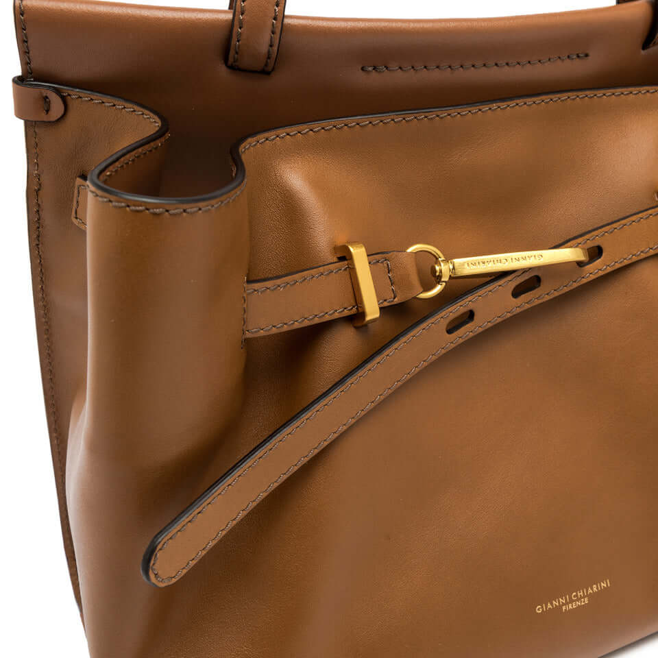 TILDA by Gianni Chiarini, elegant brown leather top handle bag with spacious interior and logoed buckle.