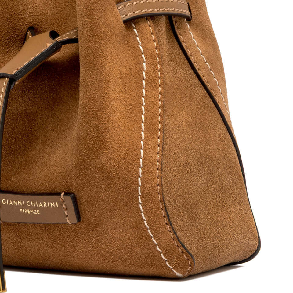 SIENNA by Gianni Chiarini, brown suede bag featuring contrast stitching and iconic metal details.