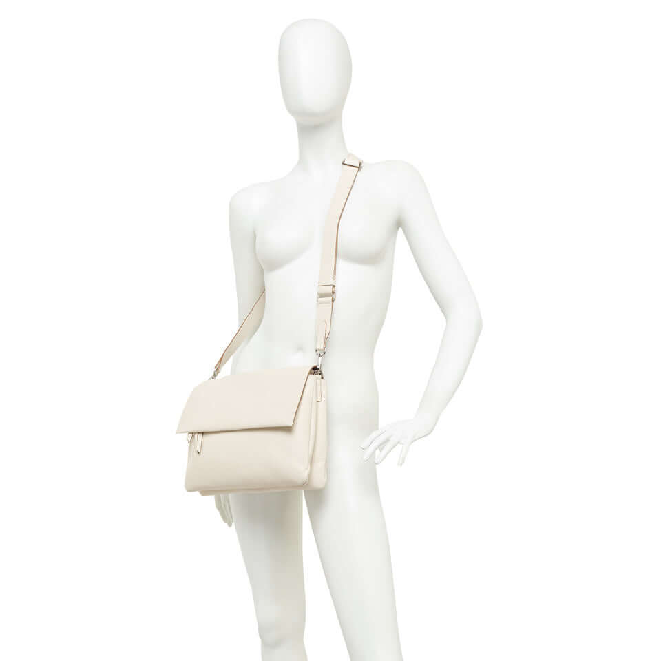 Three by Gianni Chiarini bag displayed on a mannequin, perfect for casual and elegant outfits.