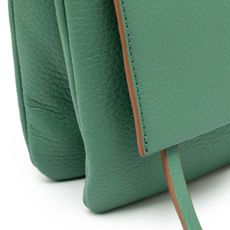 Close-up of the green leather Three Gianni Chiarini bag showcasing the texture and design details.