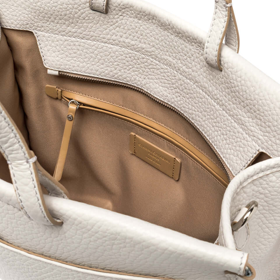 Inside view of Lavinia work bag by Gianni Chiarini Firenze, showcasing multiple compartments and a zippered pocket.