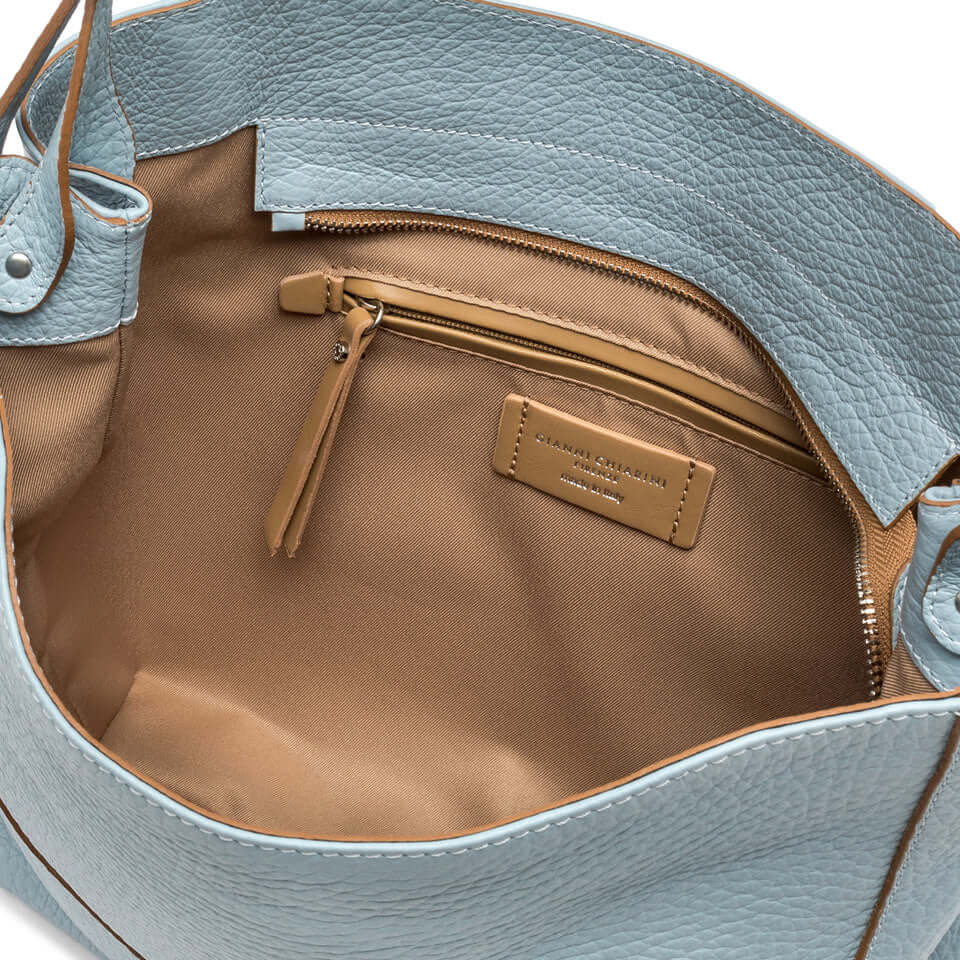 Interior view of the MINERVA handbag by Gianni Chiarini, showcasing soft leather and organized compartments.