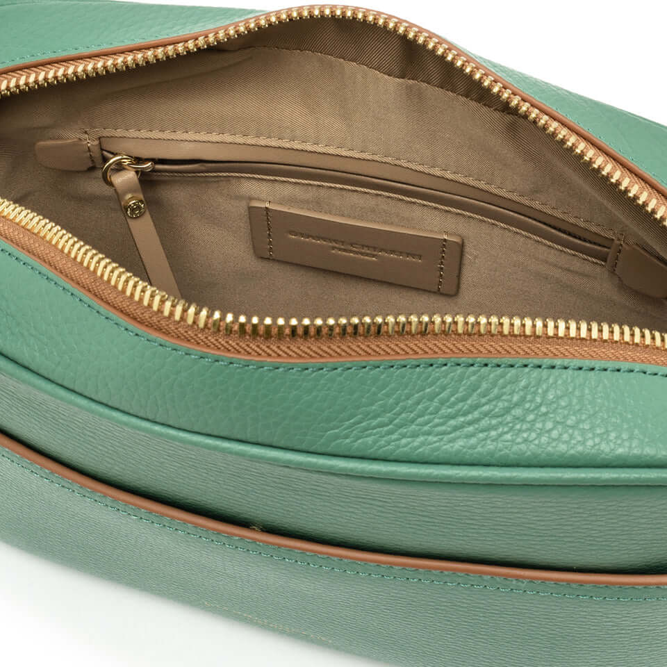 Interior view of Nina by Gianni Chiarini Firenze shoulder bag, showcasing zip pocket and elegant green leather design.