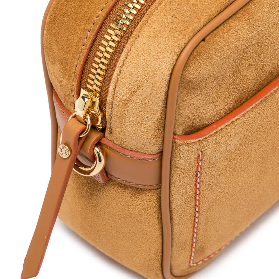 Close-up of the Nina by Gianni Chiarini Firenze, showing the zipper and suede texture in beige color.