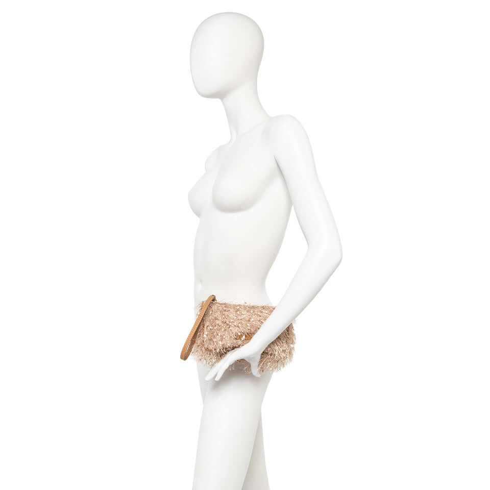 Nora Pouch by Gianni Chiarini Firenze, stylish fringed fabric bag with leather accents, side view.
