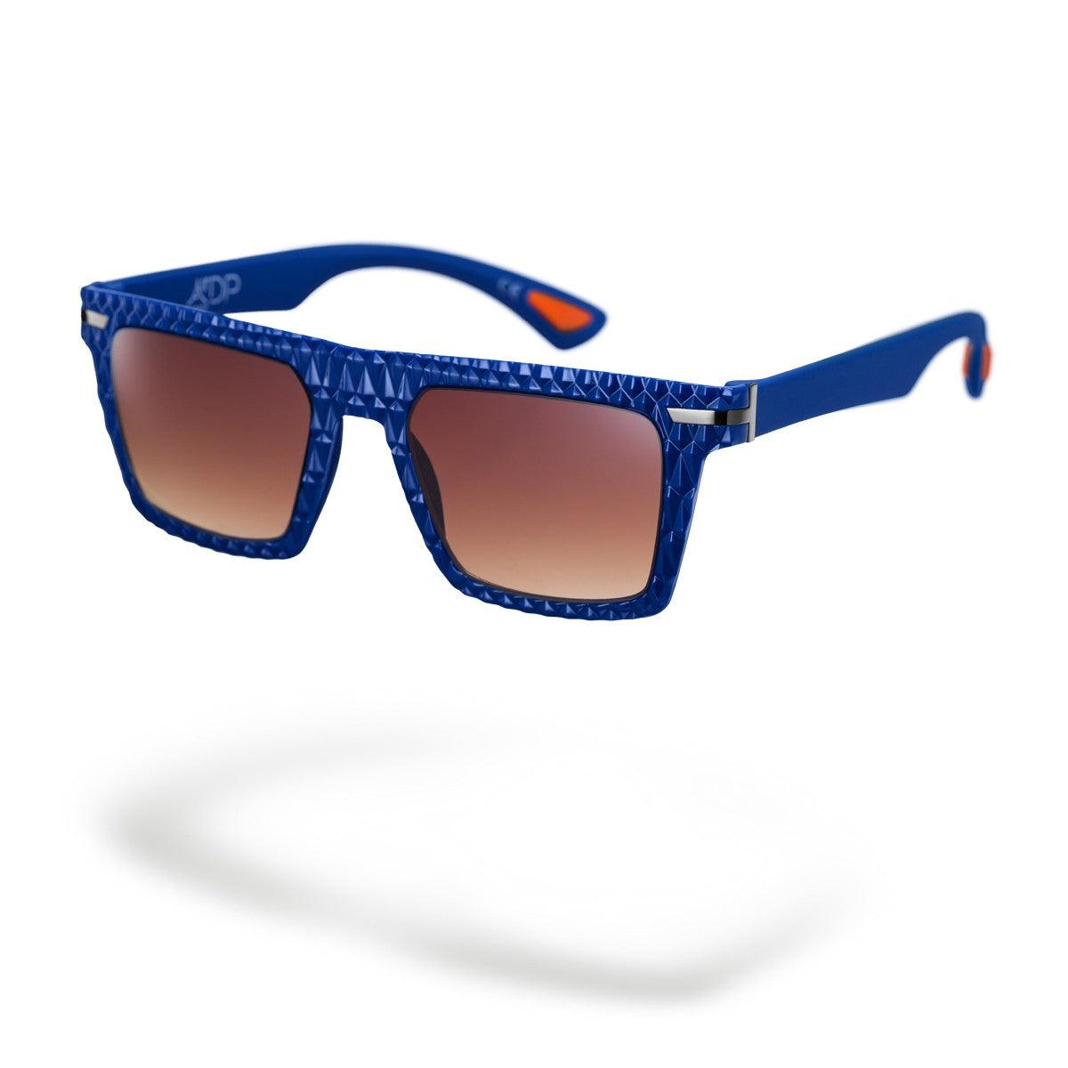 Occhiali da sole MICHI C3, design moderno con frontale blu opaco e lenti marroni sfumate, collezione Flexo.