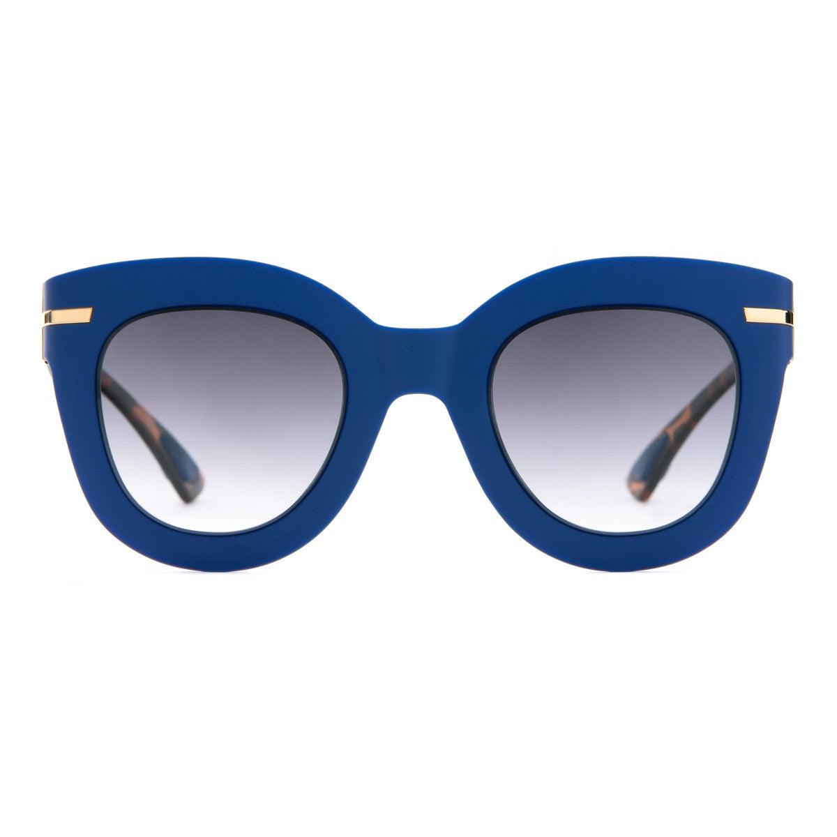 NICOLE C24 occhiali da sole blu Soft Touch crystal con forma a gatto, eleganza e design contemporaneo.