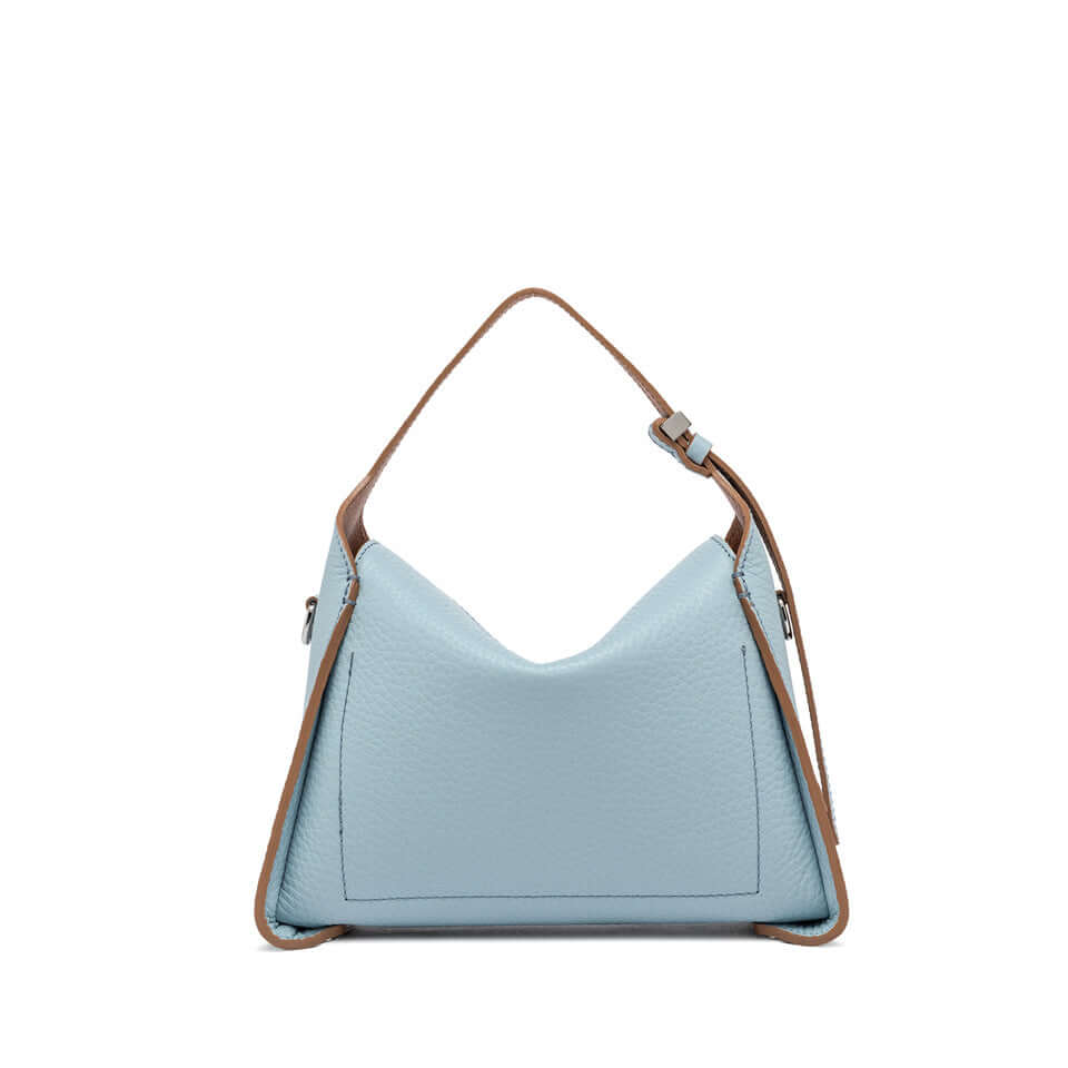 Penelope bag in light blue leather, featuring a unique boxy shape and adjustable shoulder strap.