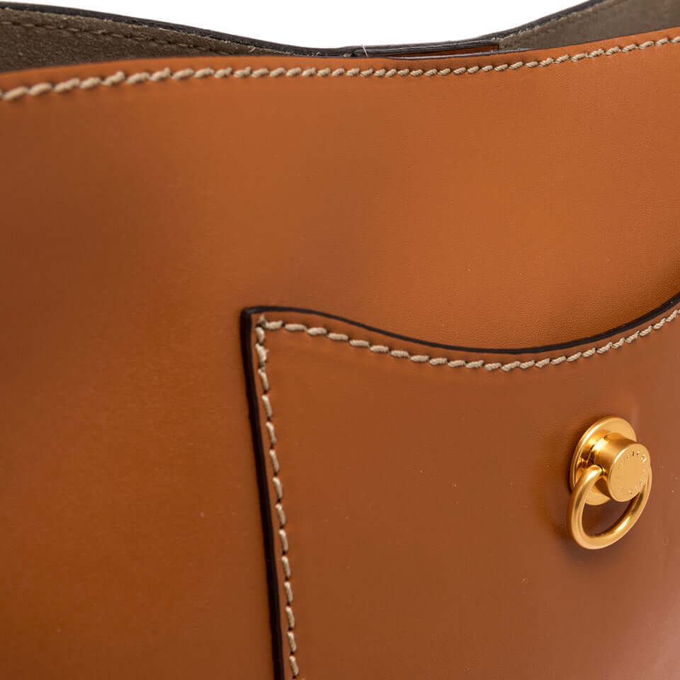Close-up of Rubina handbag by Gianni Chiarini Firenze, showcasing smooth leather, pocket detail, and gold clasp.
