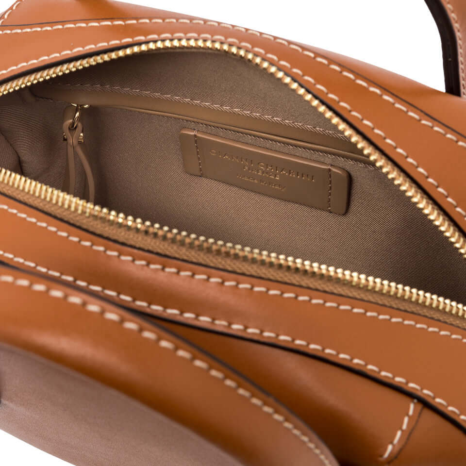 Interior view of the SABRINA small bowling bag, showcasing smooth leather, zipper pocket, and stylish stitching.