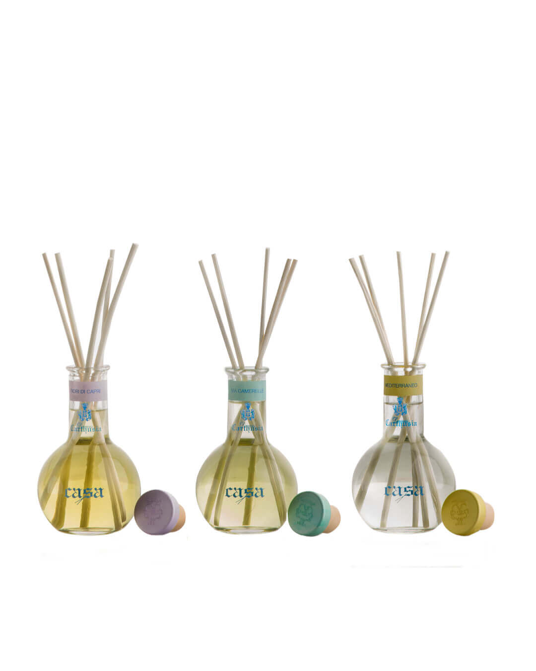 Set Casa Tris Diffusore with three scented bottles and natural sticks for home fragrance.