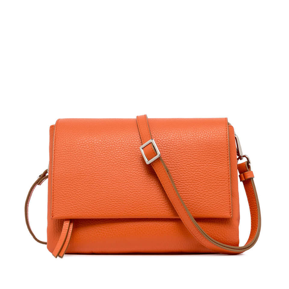Stylish orange leather handbag with adjustable strap, perfect for casual and elegant outfits.