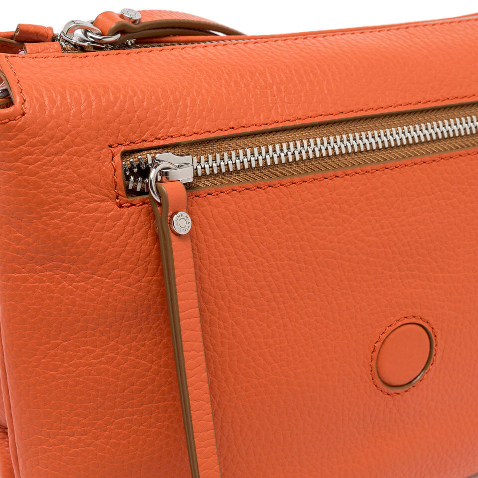 Close-up of the orange Gianni Chiarini Firenze leather bag featuring a zip pocket detail.