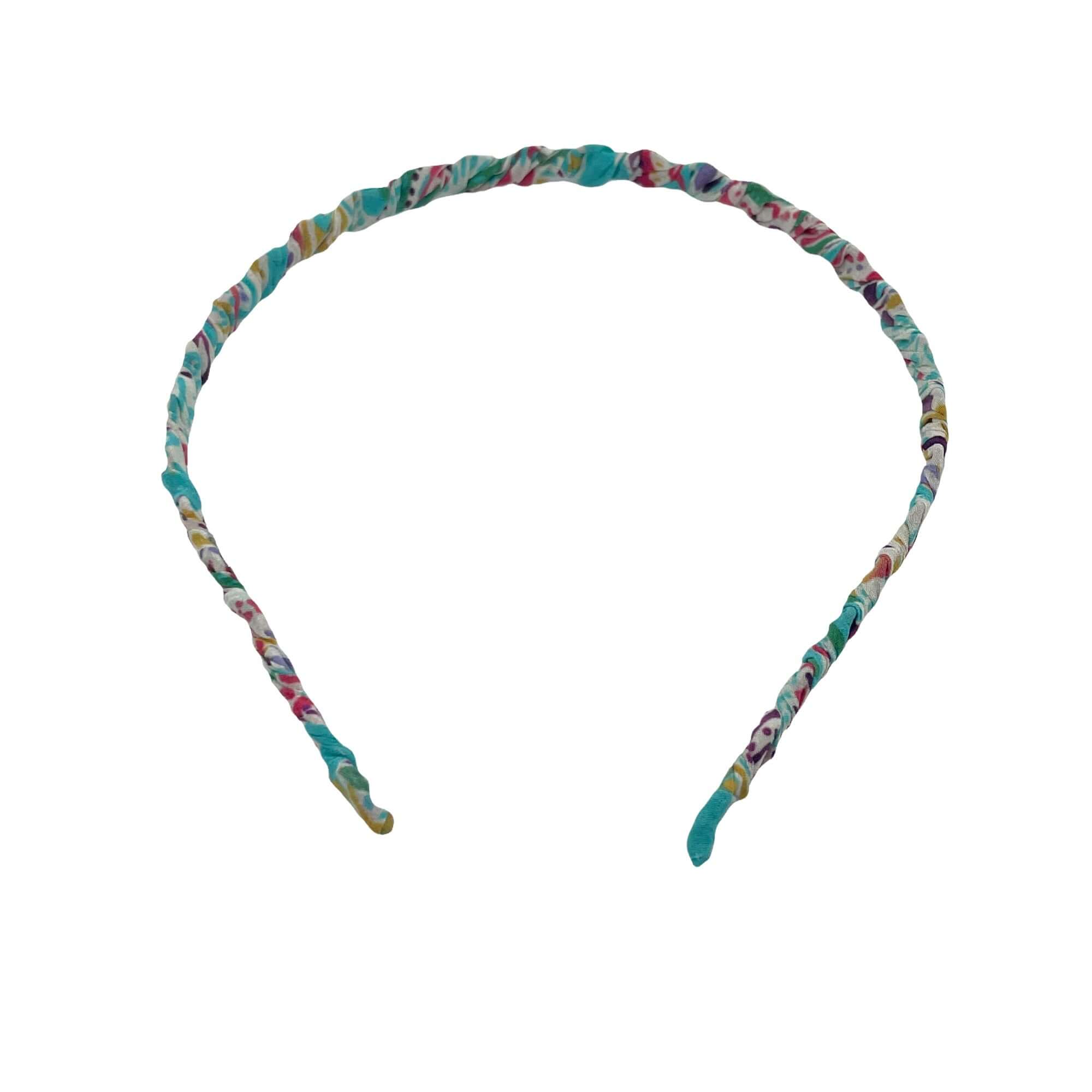 Cerchietto Rombetti in seta turchese con fantasia colorata, accessorio per capelli elegante e moderno.