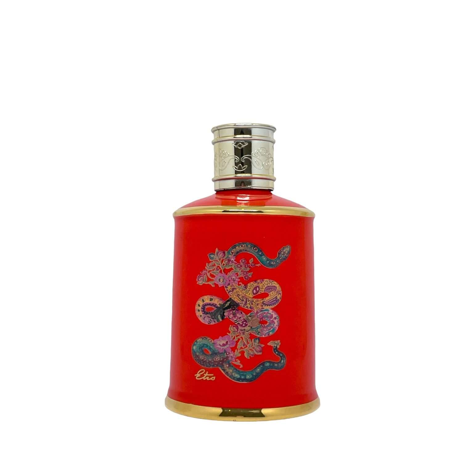 Elegant orange ceramic diffuser with Kaa design, presented in a handmade Etro fabric box.