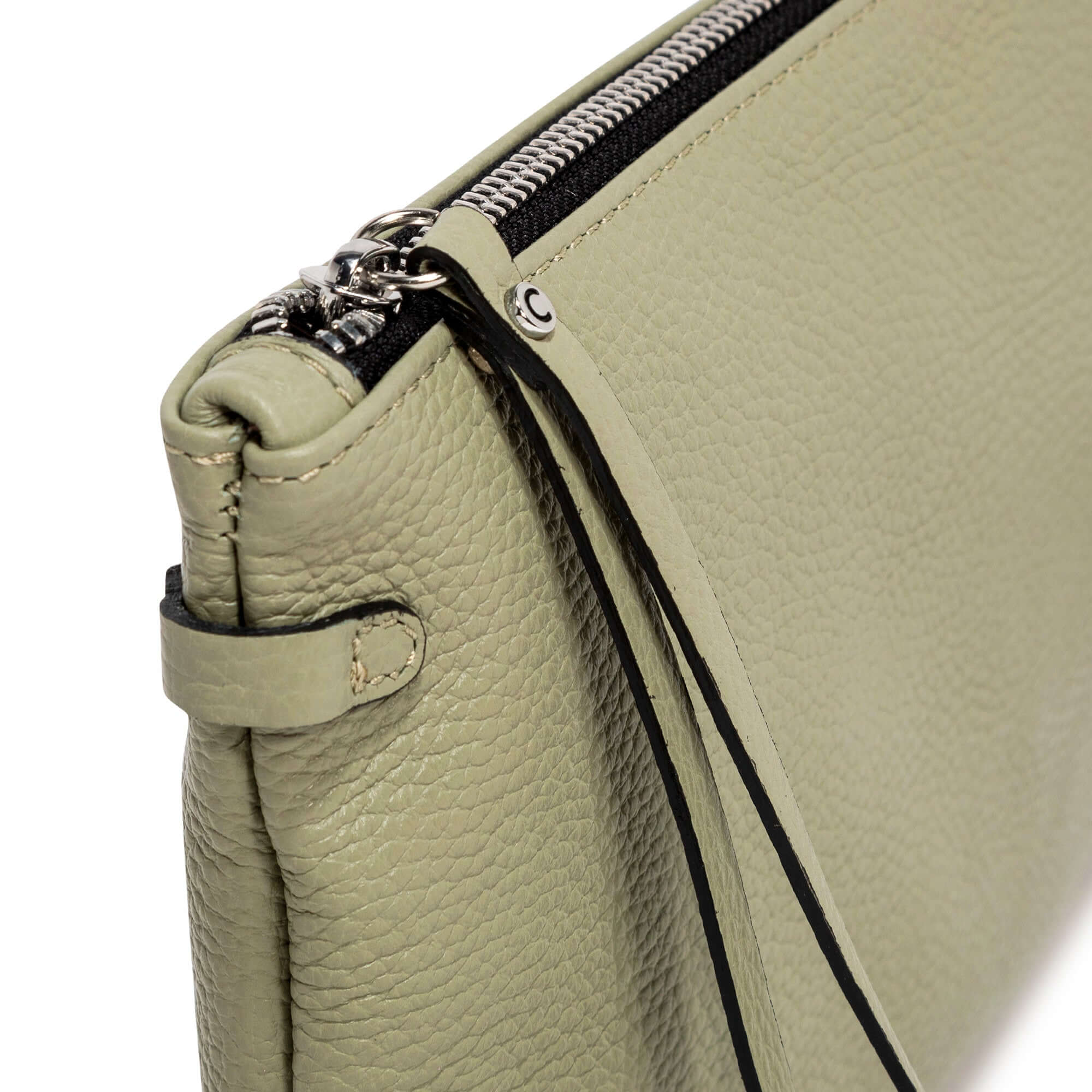 Close-up of the HERMY bag made from premium hammered leather, featuring a contrasting zip detail and removable strap.