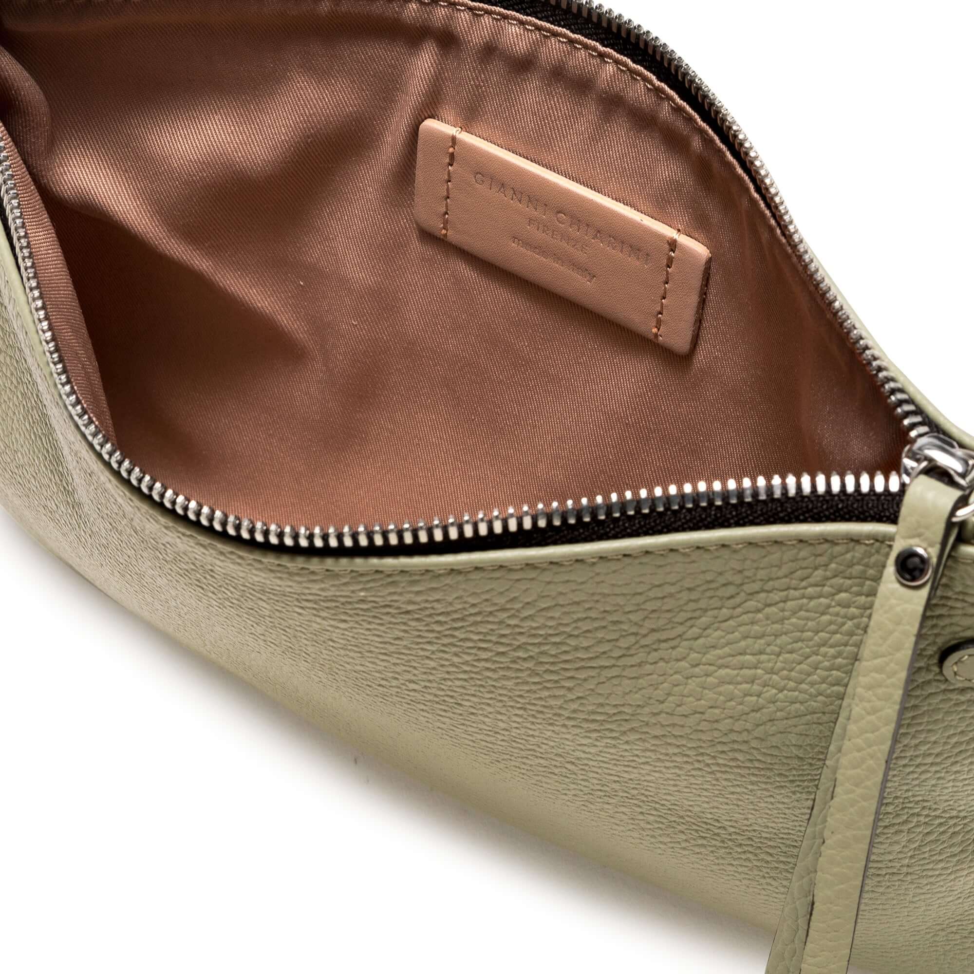 Interior view of HERMY bag made from premium hammered leather, showcasing zip closure and removable strap, sleek design.