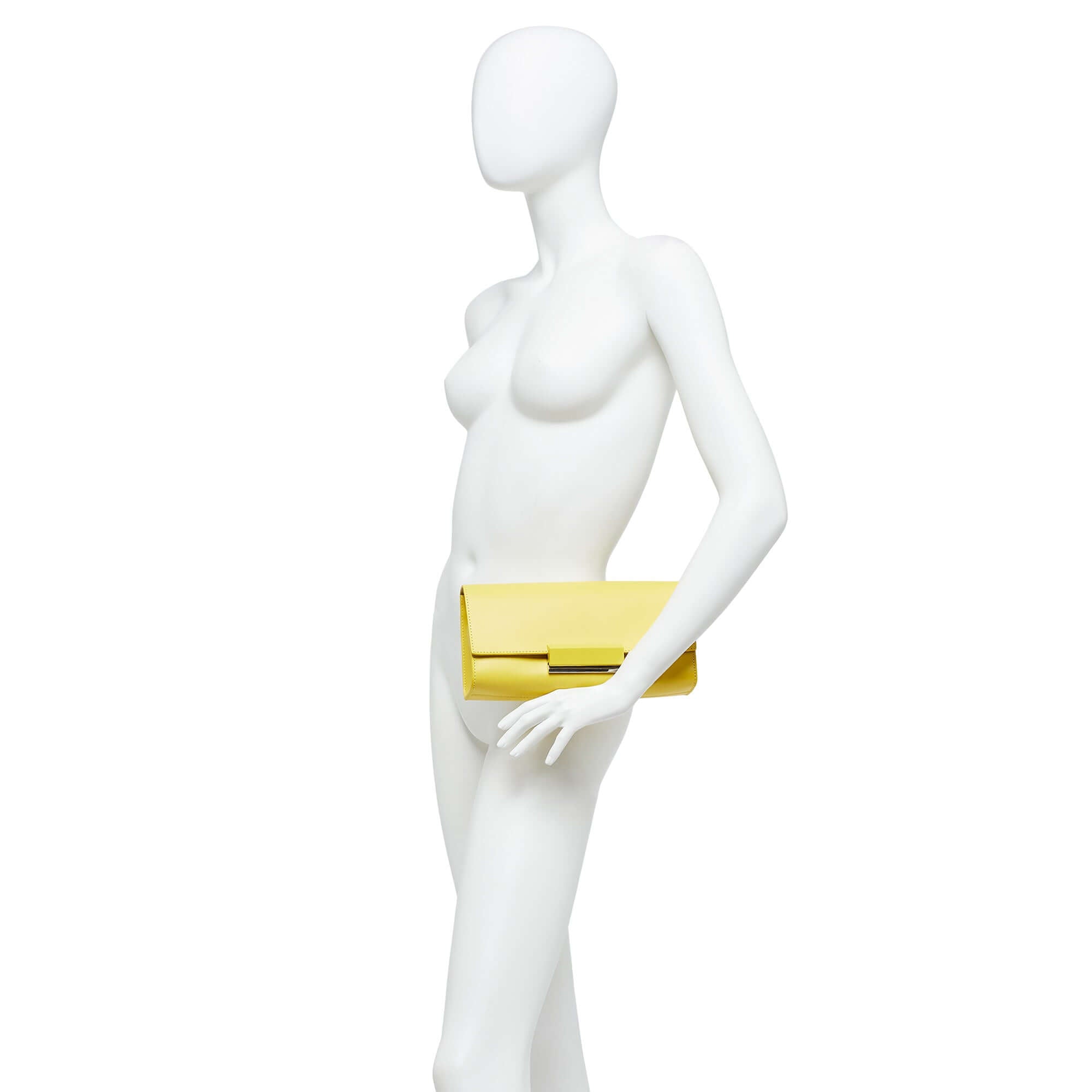 Yellow Lily clutch bag by Gianni Chiarini on a mannequin, showcasing smooth leather and snap closure.