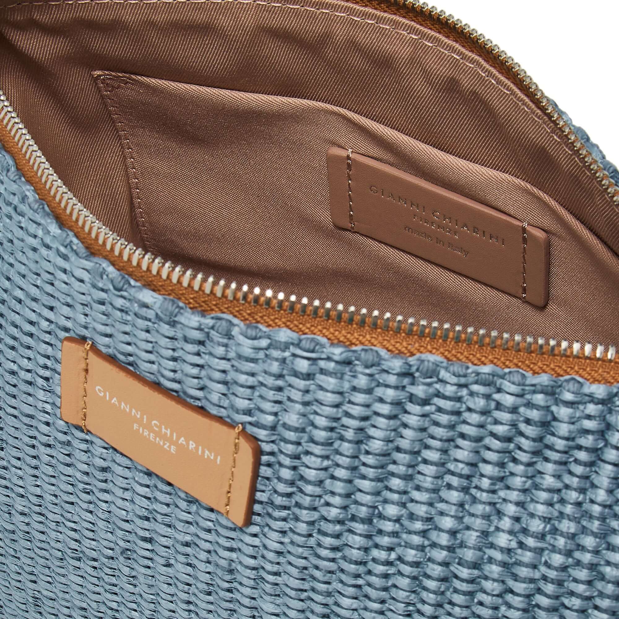 Nora Pouch inner view showcasing woven straw texture and leather details, perfect for chic everyday use.