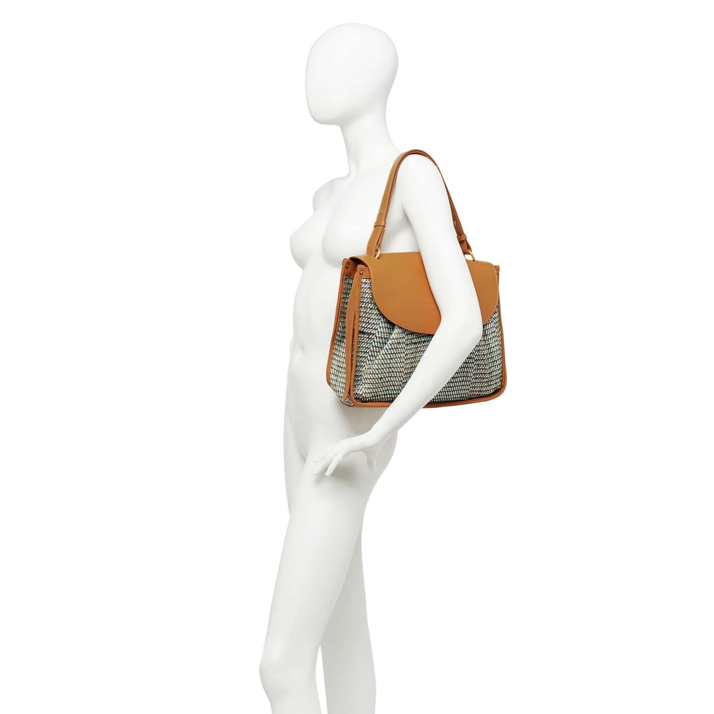 Side view of the Louise bag by Gianni Chiarini, featuring woven fabric and a leather strap, perfect for everyday use.