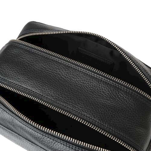 Interior view of the Micron Beauty Case in leather, featuring two zip compartments and a nylon lining.