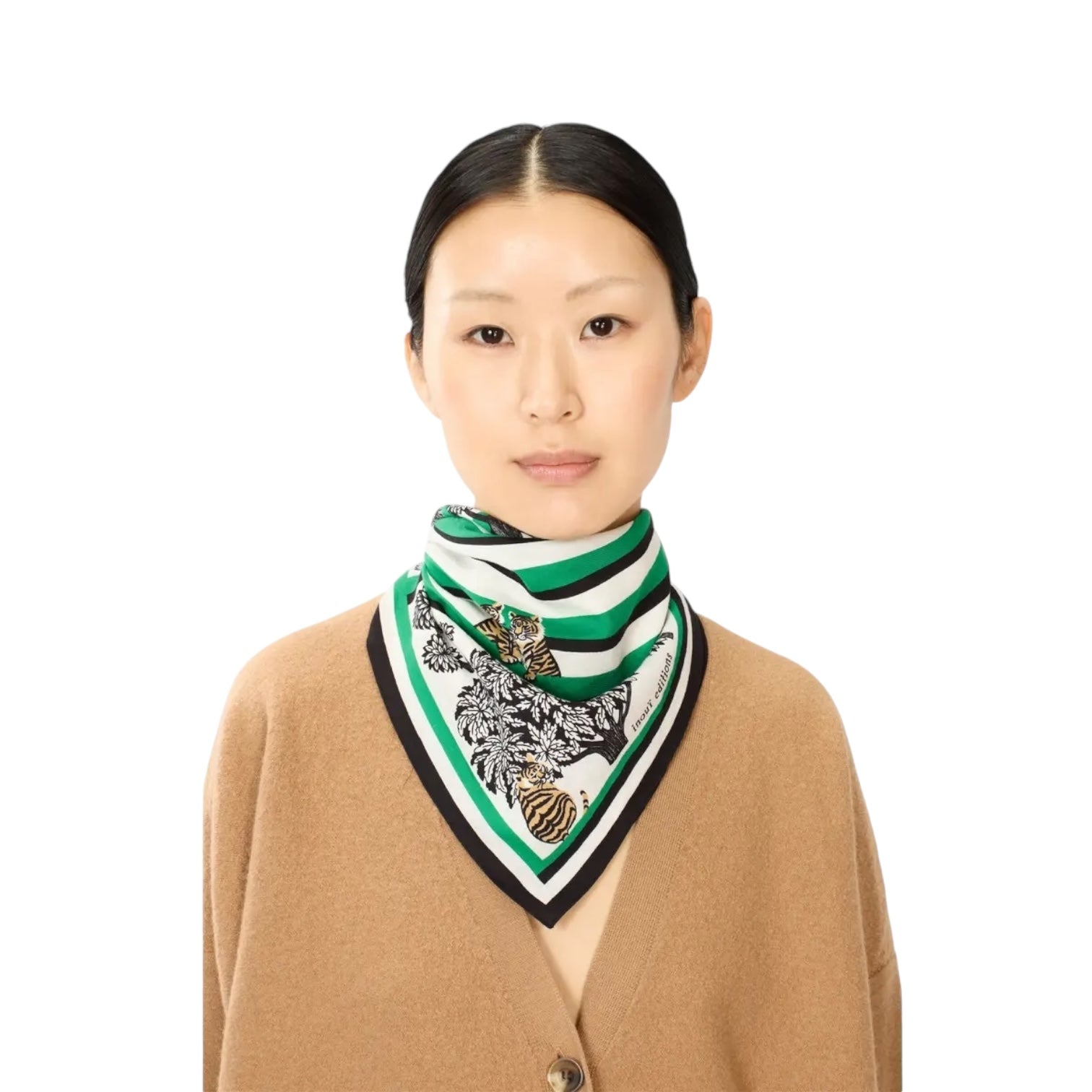 Model wearing Foulard Quadrato Astrologie Labyrinthe Verde, chic green and white patterned scarf. Perfect accessory for day or evening.