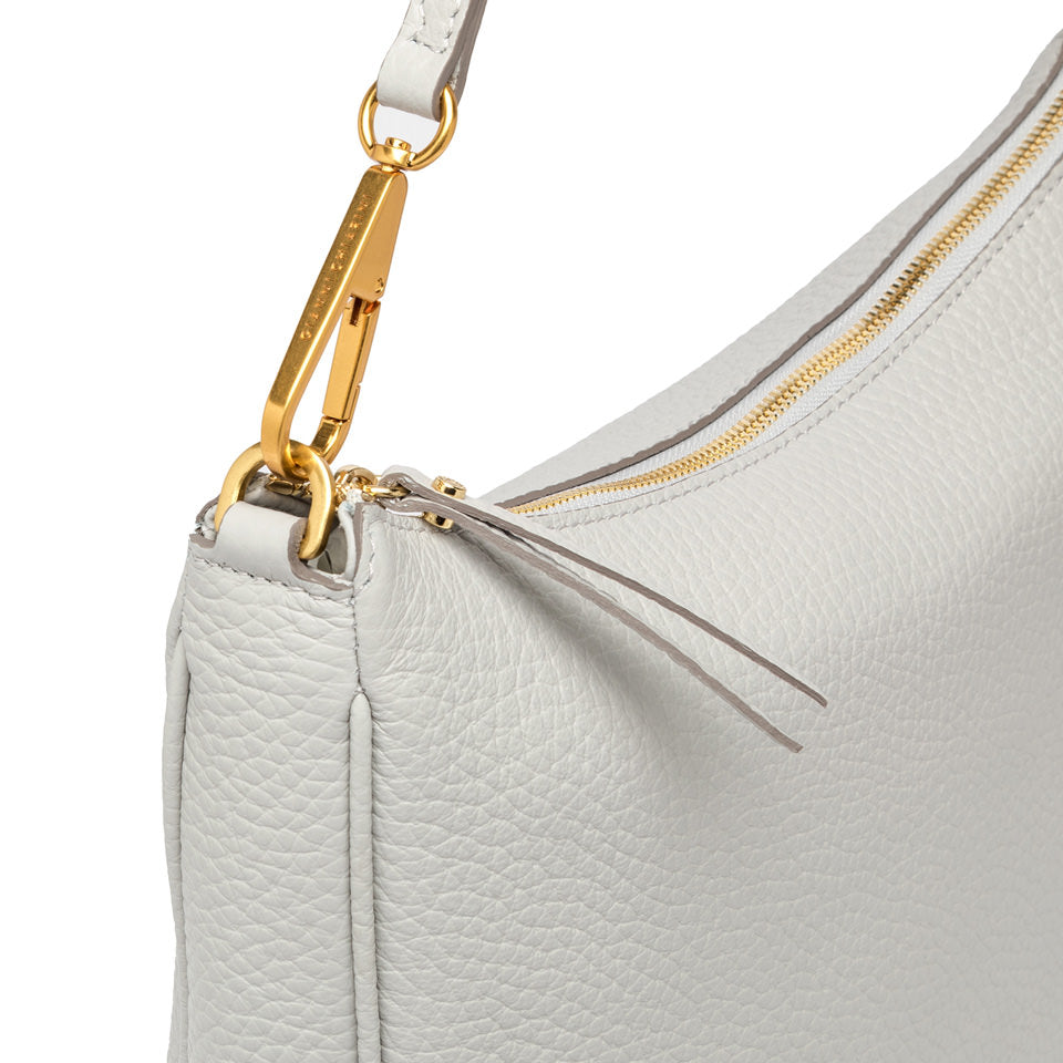 Detail of Brooke large shoulder bag in soft bubble leather with gold zipper and removable strap.