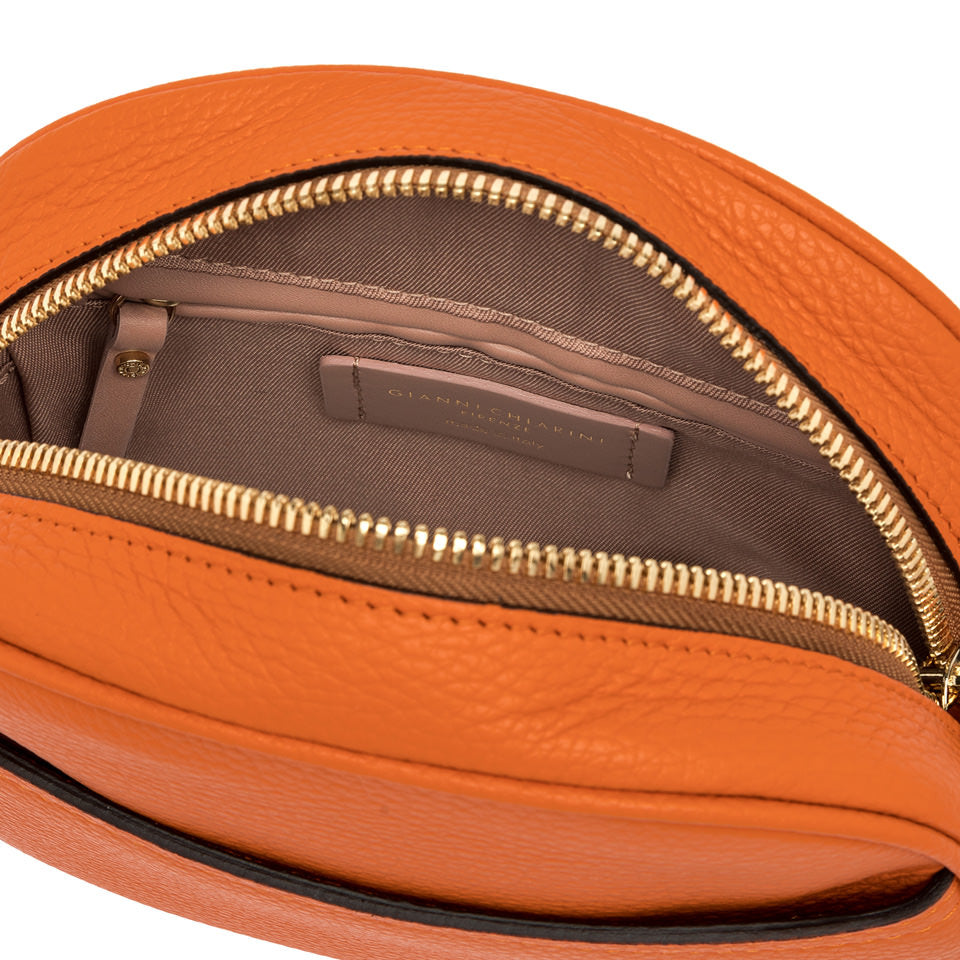 Interior view of La Nina by Gianni Chiarini, featuring zippered compartment and soft lining in orange leather bag.