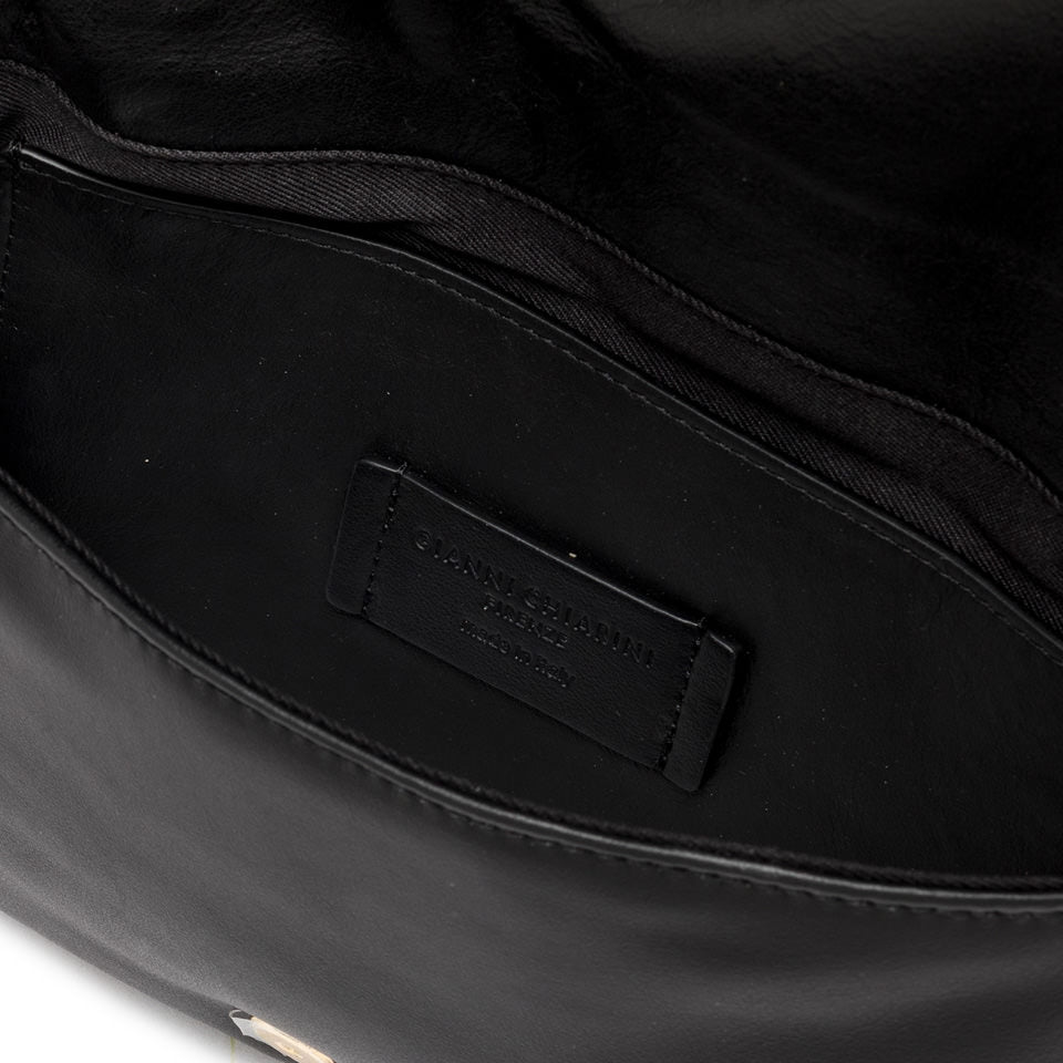 Interior view of the Glenda handbag showing the black leather lining and brand label.