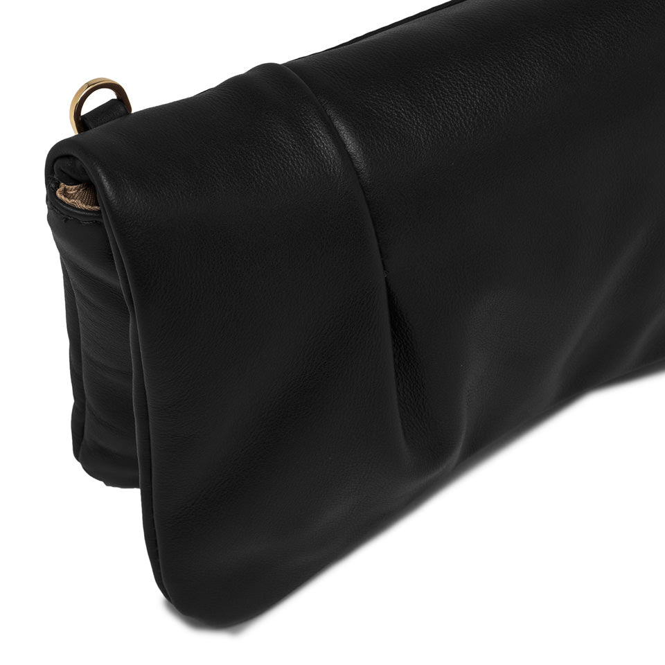 Close-up of Glenda handbag in black laminated leather with plush design and chain strap detail.