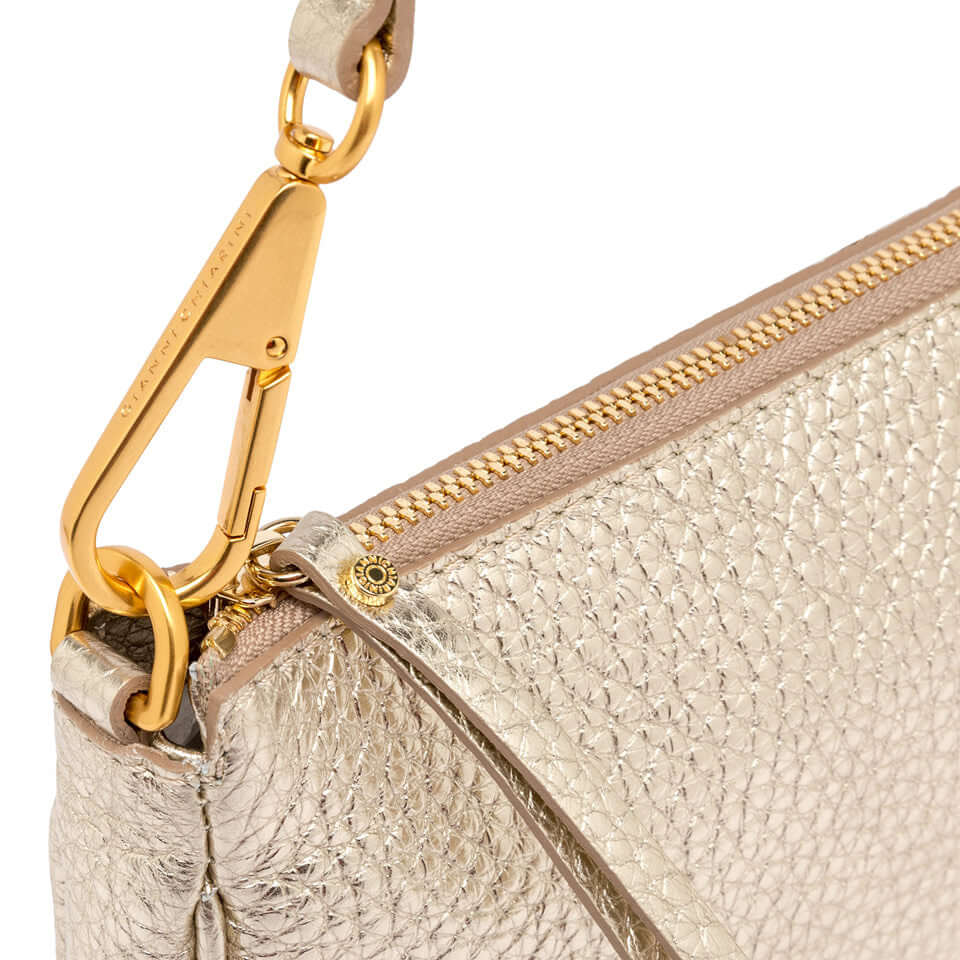 Close-up of the gold clasp and zipper detail on the Brooke handbag by Gianni Chiarini Firenze.