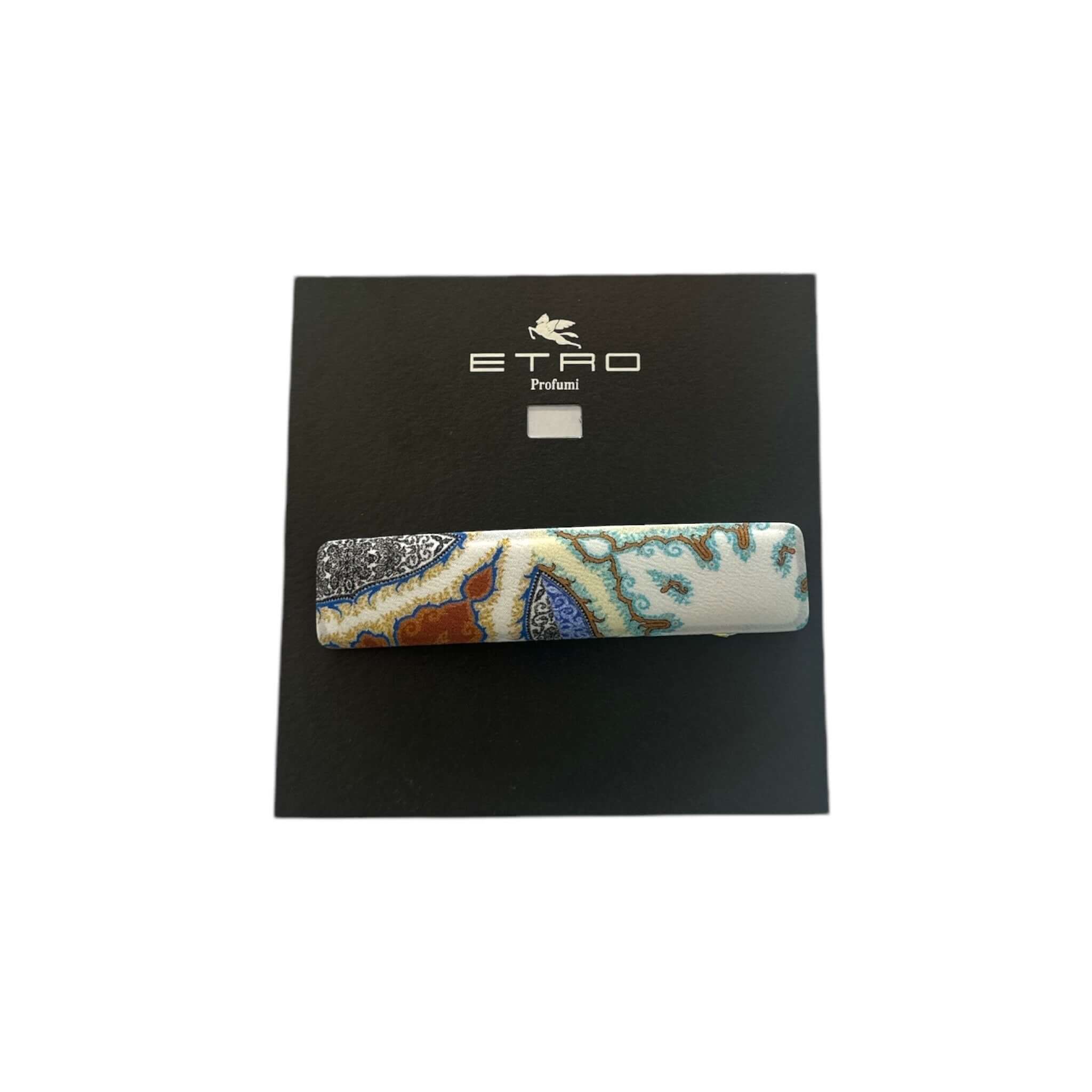 Elegant French barrette in high-quality silk, featuring a unique paisley design on a stylish packaging.