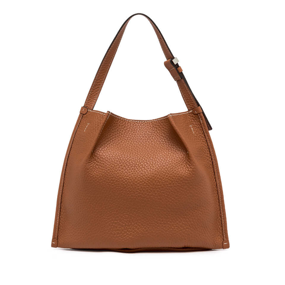 Dory handbag in brown leather, featuring an adjustable strap and simple design for casual styles.