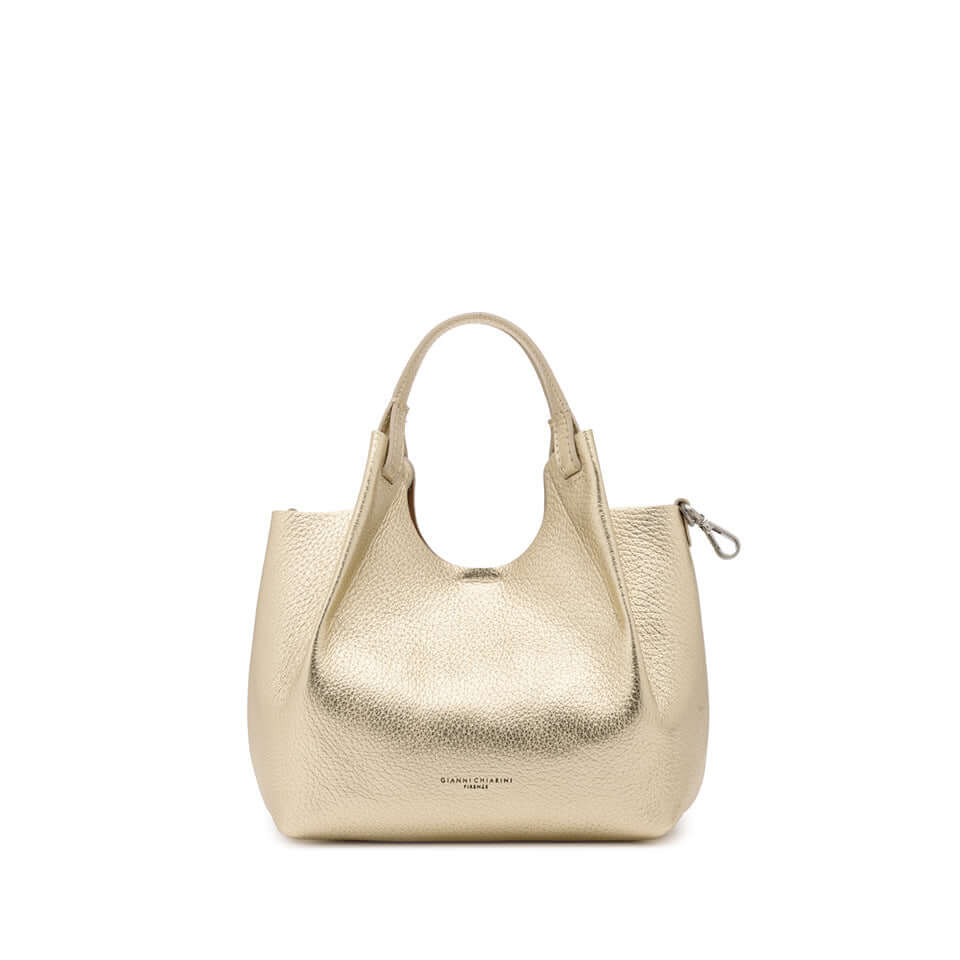 Gold DUA handbag made of textured leather with dual handles and zipper detail, perfect for elevating any outfit.