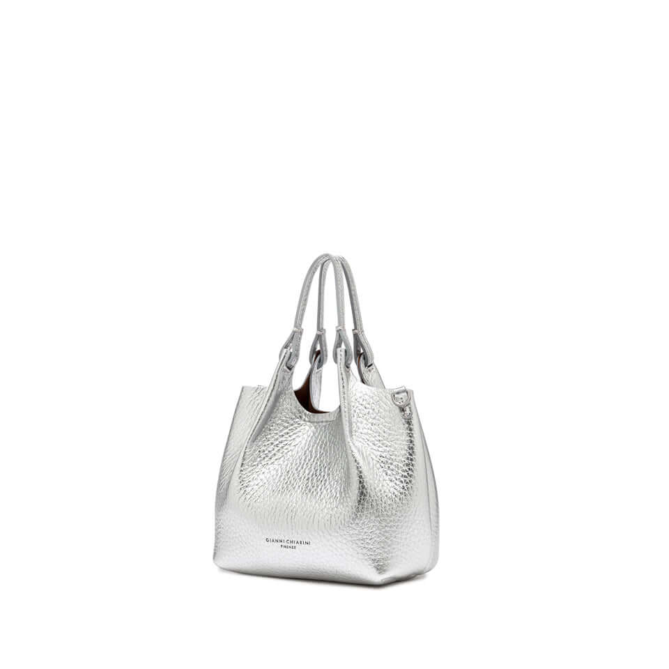 Stylish DUA handbag in silver leather with dual handles and magnetic closure, perfect for enhancing any outfit.