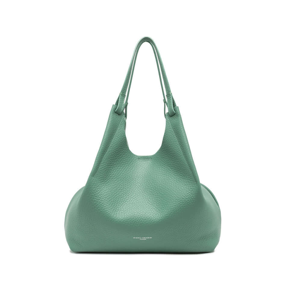 Contemporary DUA bag in green double grain leather, featuring leather handles and a magnetic closure. Size: 34x38x16 cm.