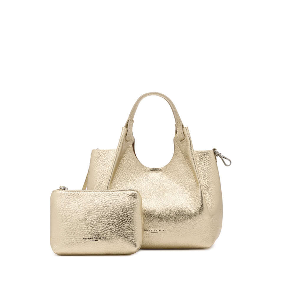 DUA gold leather handbag and matching pouch, stylish and practical accessory for any outfit.