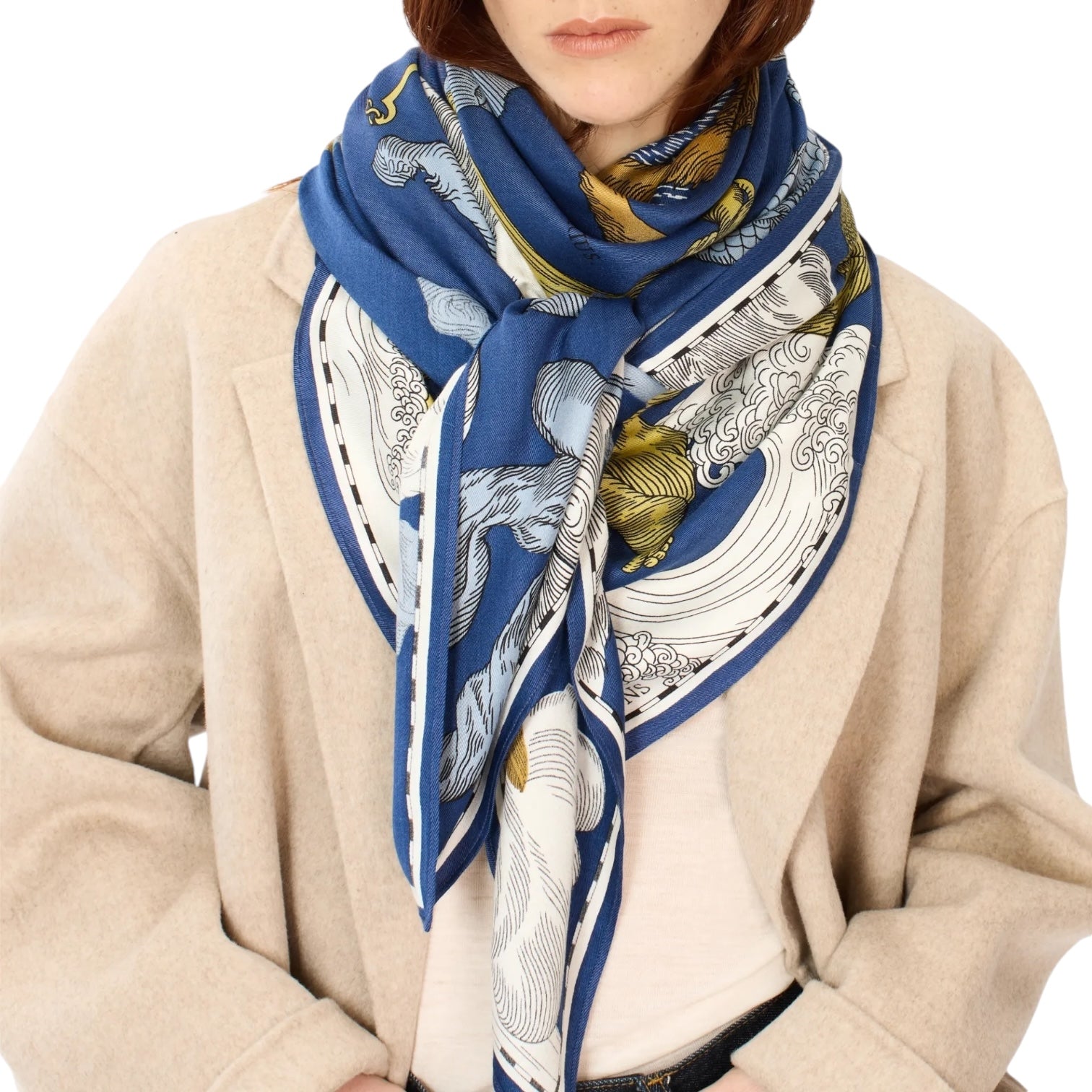 Elegant blue square scarf with unique astrology prints, styled as a chic accessory on a model.