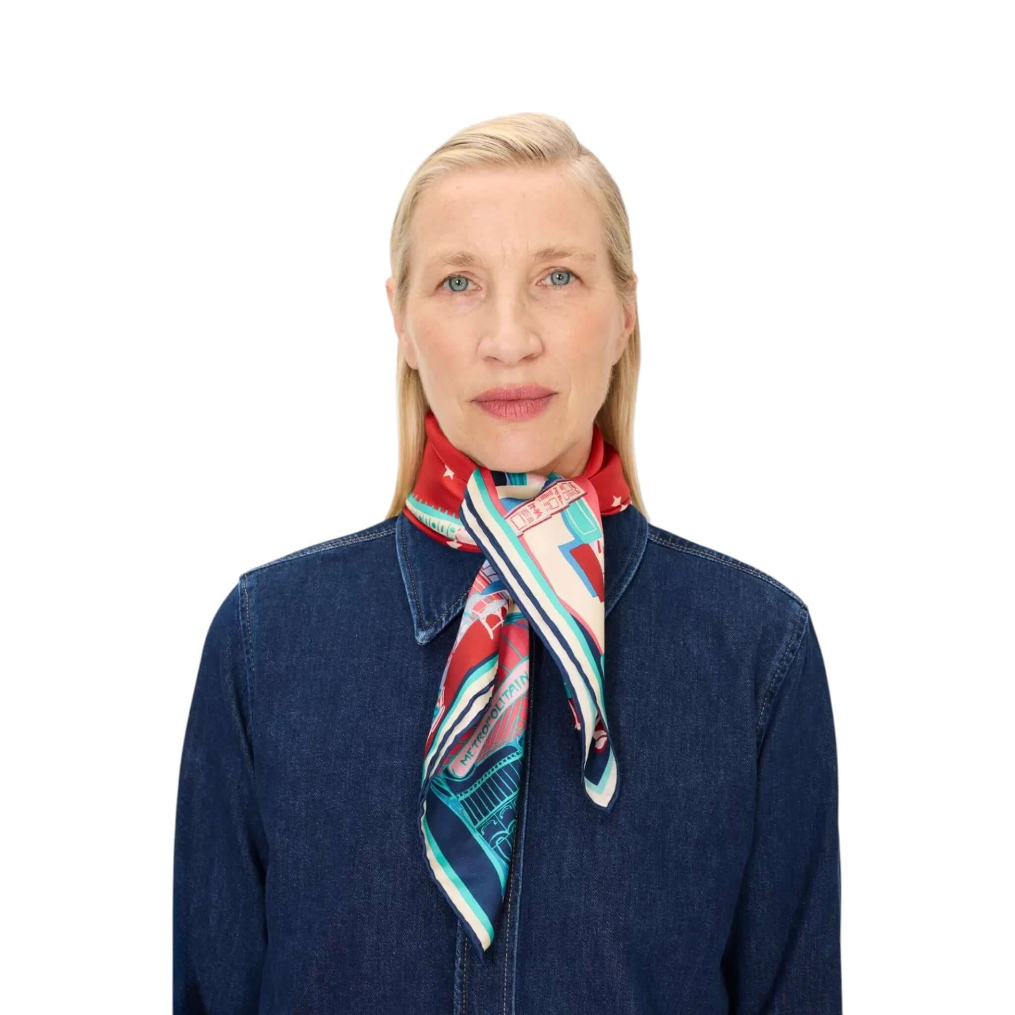 Foulard Quadrato J'aime Paris worn by a model, showcasing vibrant colors and intricate designs, styled elegantly.